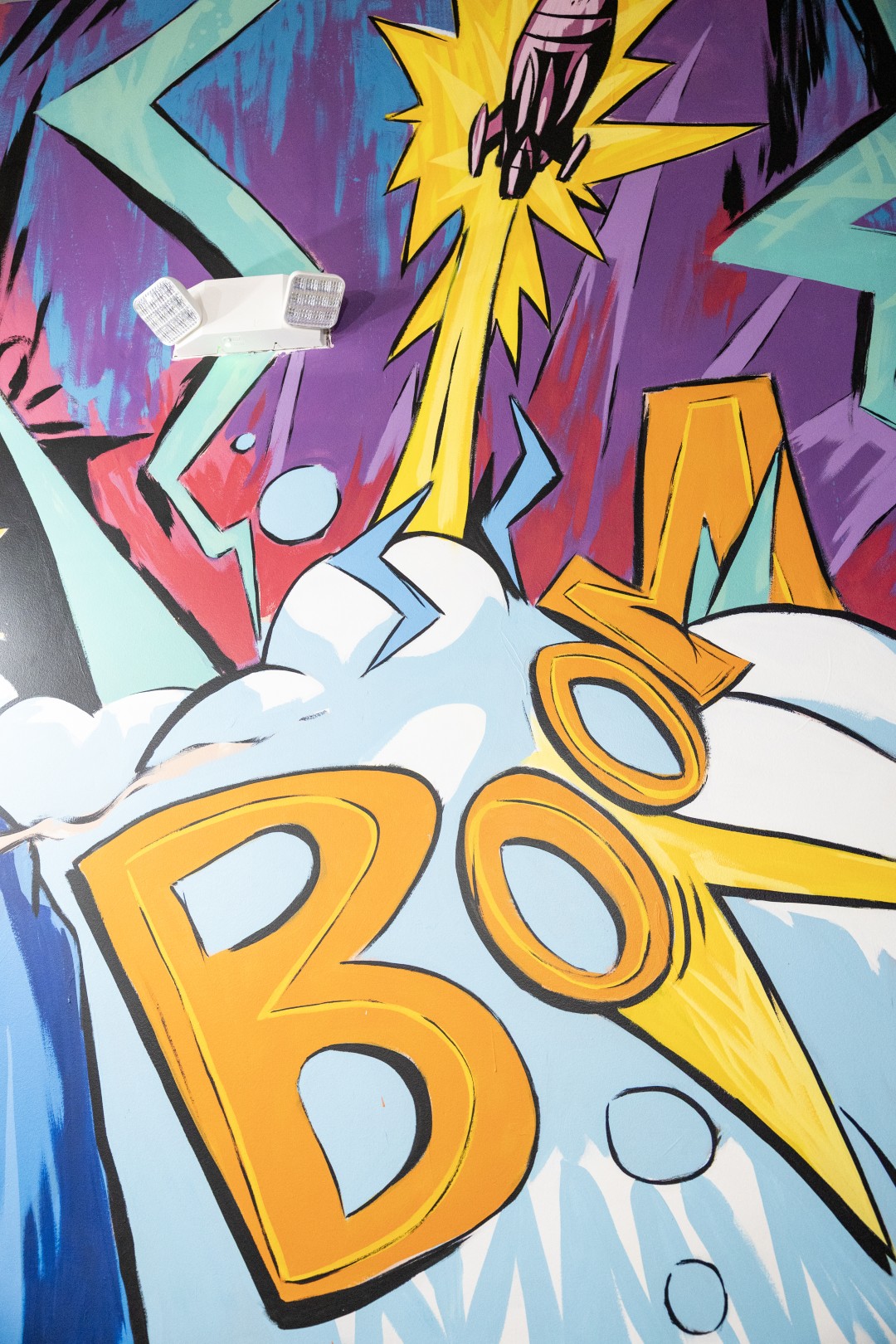 Hand-painted Boom Boom mural lettering on the restaurant wall